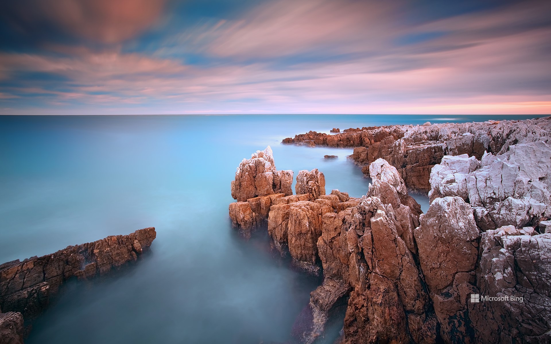 Rocks in the sea at sunset, Cap d'Antibes, Provence-Alpes-Côte d'Azur