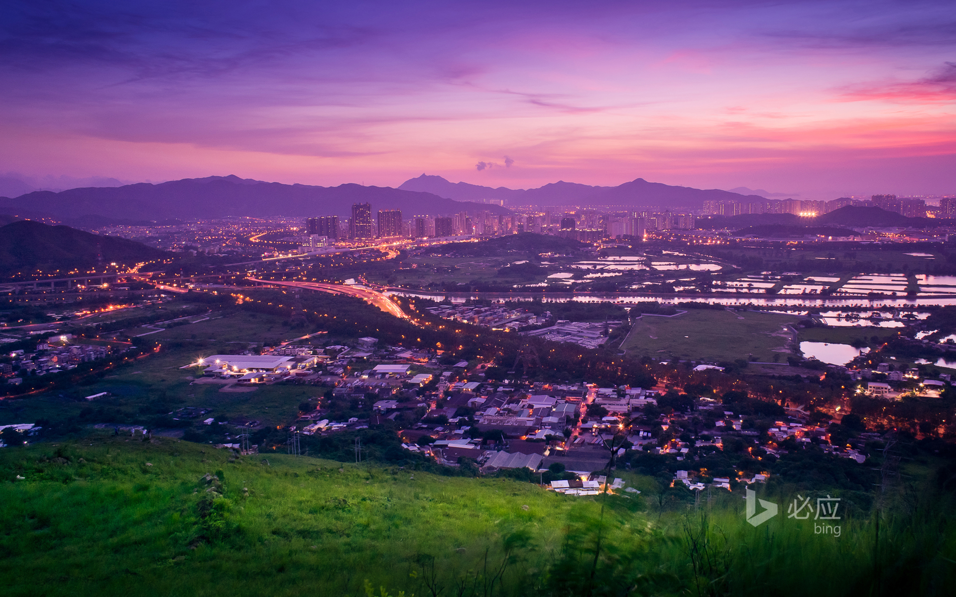 Enjoy the scenery of Yuen Long from a hill in Hong Kong at sunset