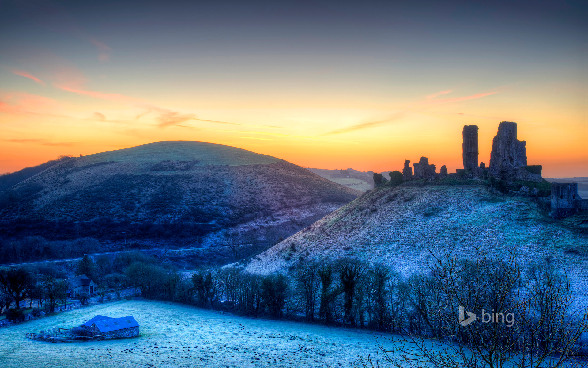 Colourful sunrise over Corfe Castle, Dorset, United Kingdom