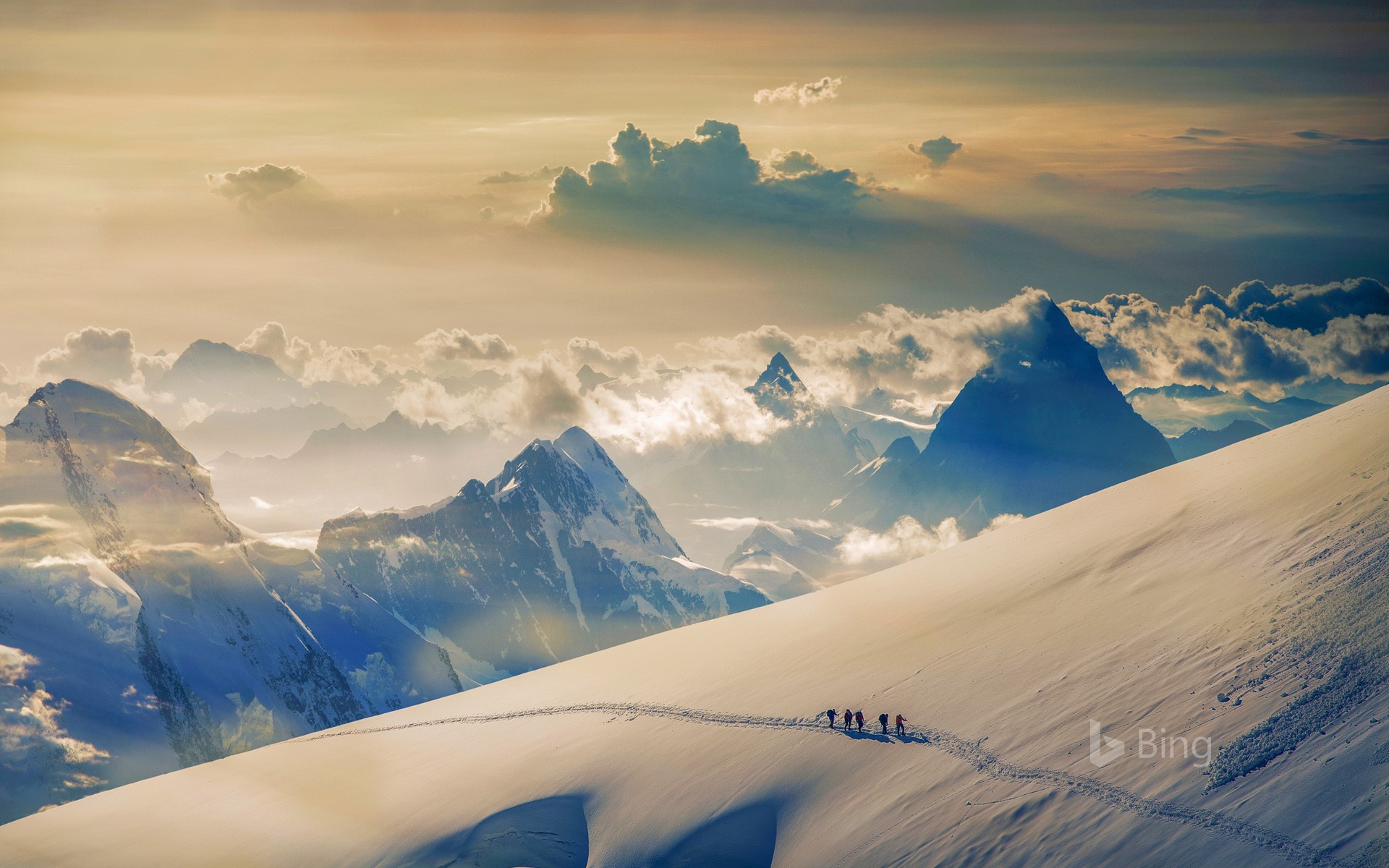 Climbers ascending Jungfrau in the Bernese Alps, Switzerland