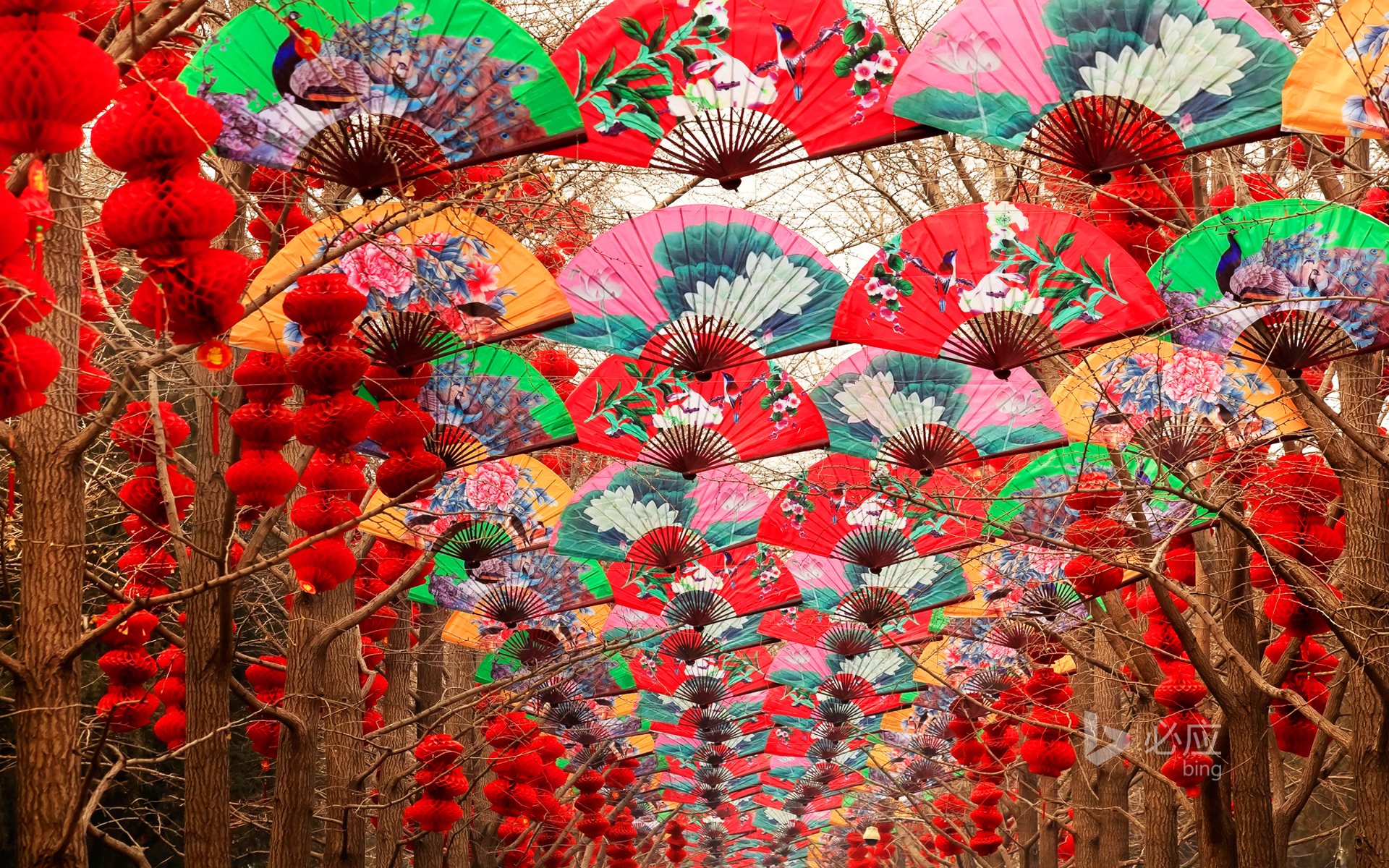 Paper fans and red lanterns during the Spring Festival in Beijing Temple of Heaven