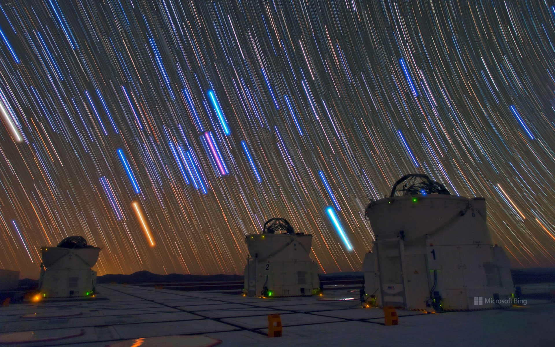 Telescopes and star trails at Paranal Observatory, Atacama Desert, Chile