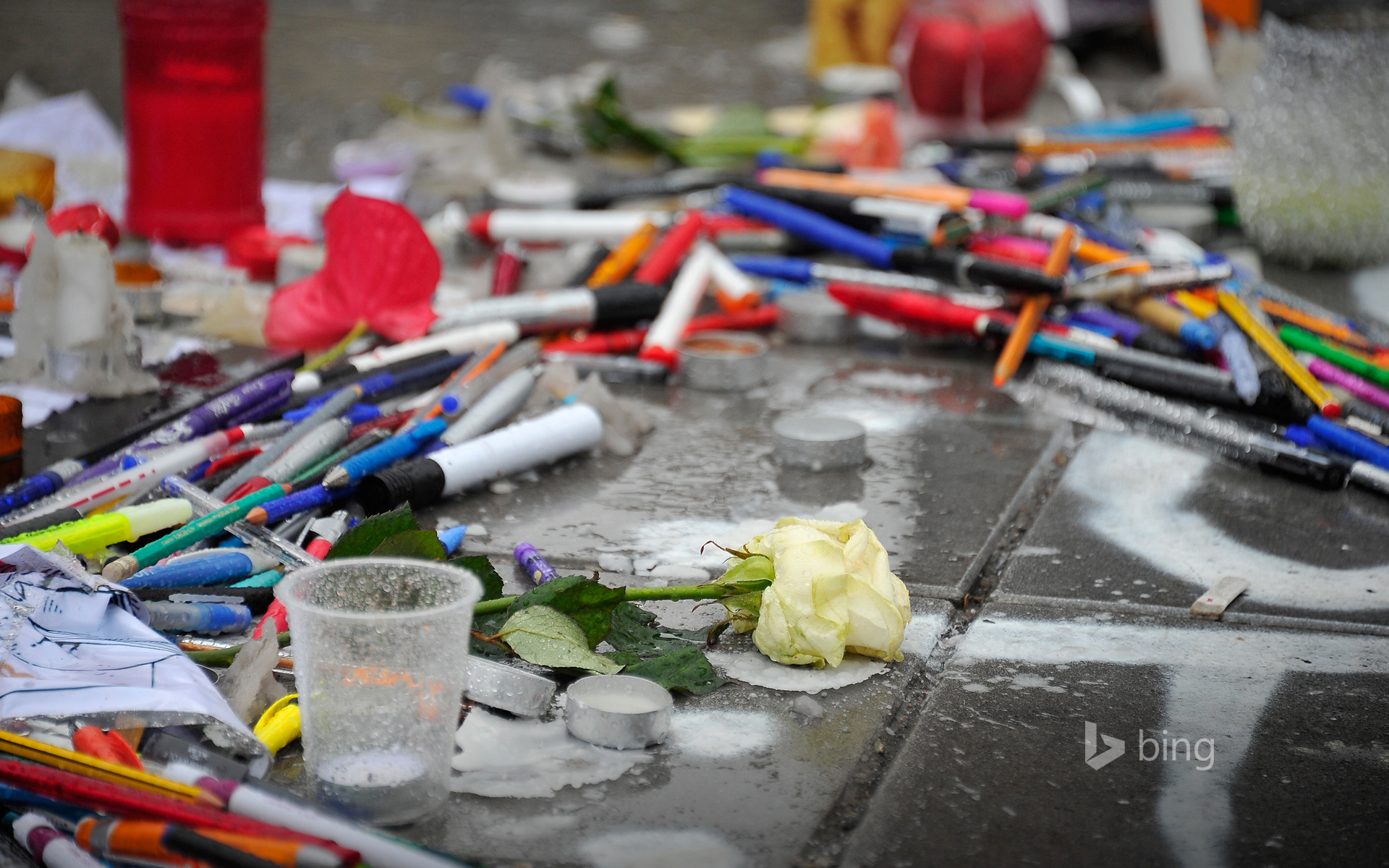 Tributes of candles, pens and flowers at Place de la Republique, Paris, France