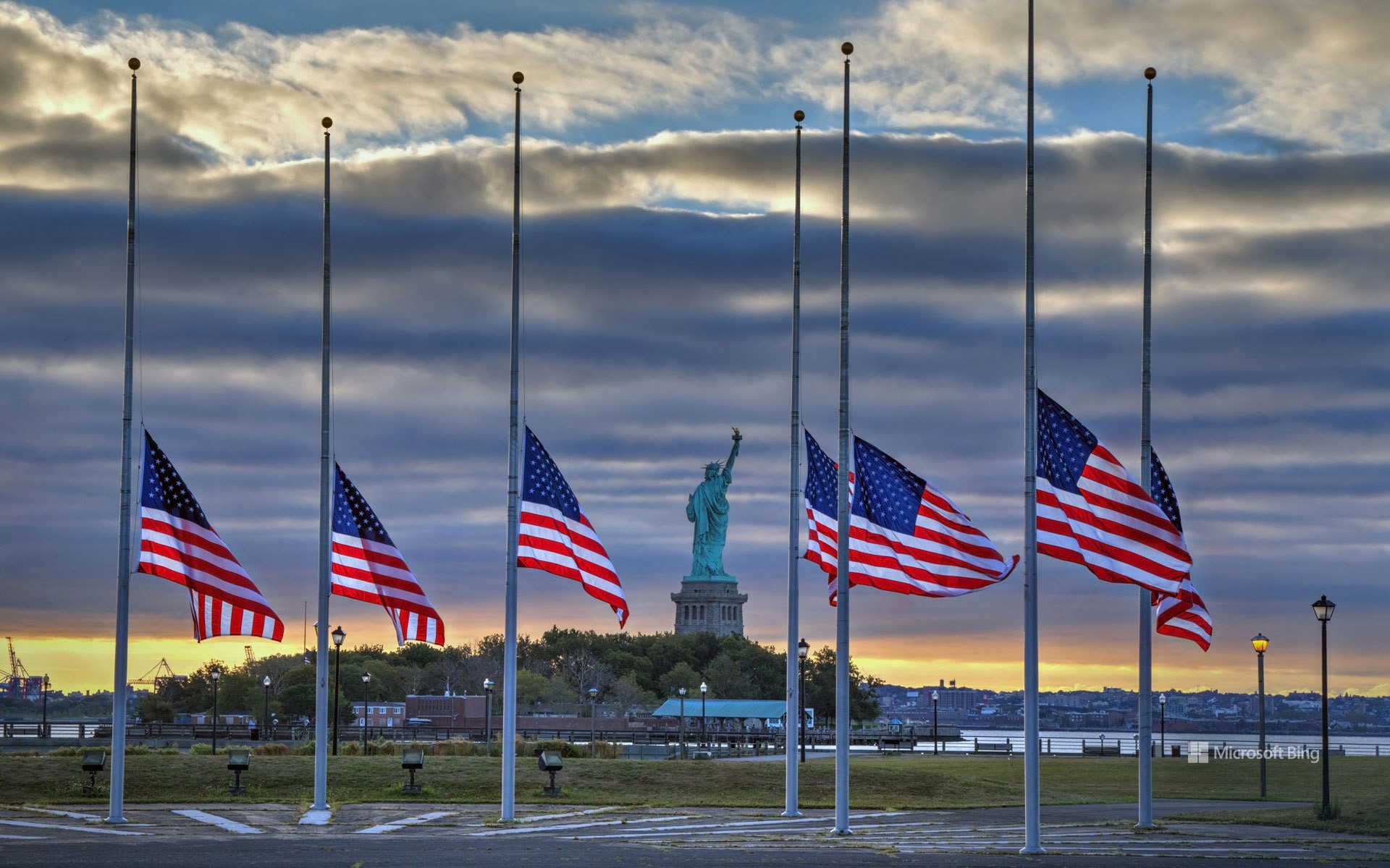 Statue of Liberty seen behind US flags at half-staff for the anniversary of September 11 in 2014, New York City