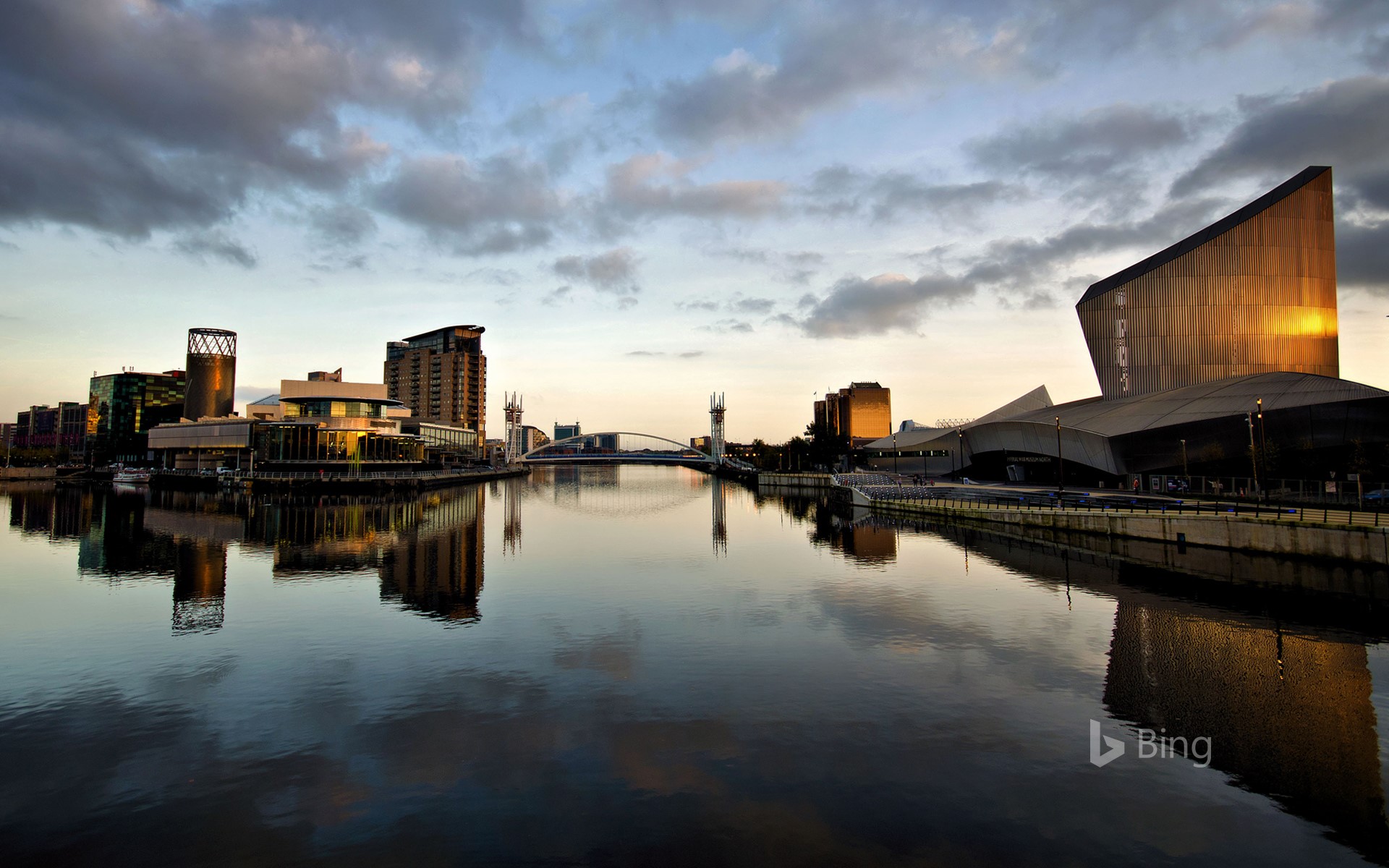 The Lowry Theatre and Imperial War Museum North, with reflections at Salford Quays, Greater Manchester