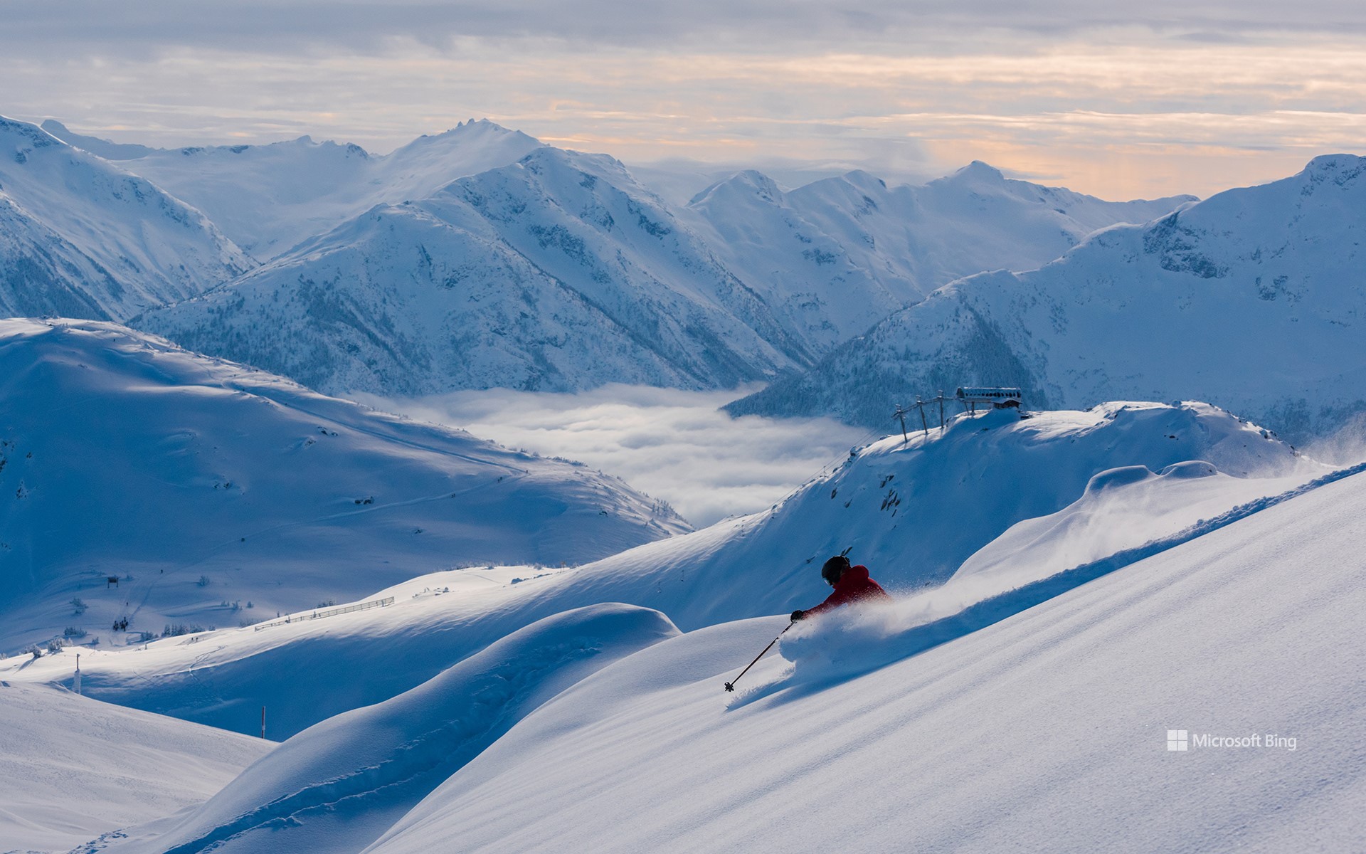 Skier making a turn in pristine snow in Whistler, B.C.